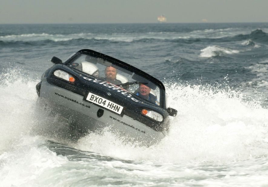 Branson, left, pilots an amphibious vehicle during a record-breaking crossing of the English Channel in 2004. He crossed the channel in one hour, 40 minutes and six seconds.