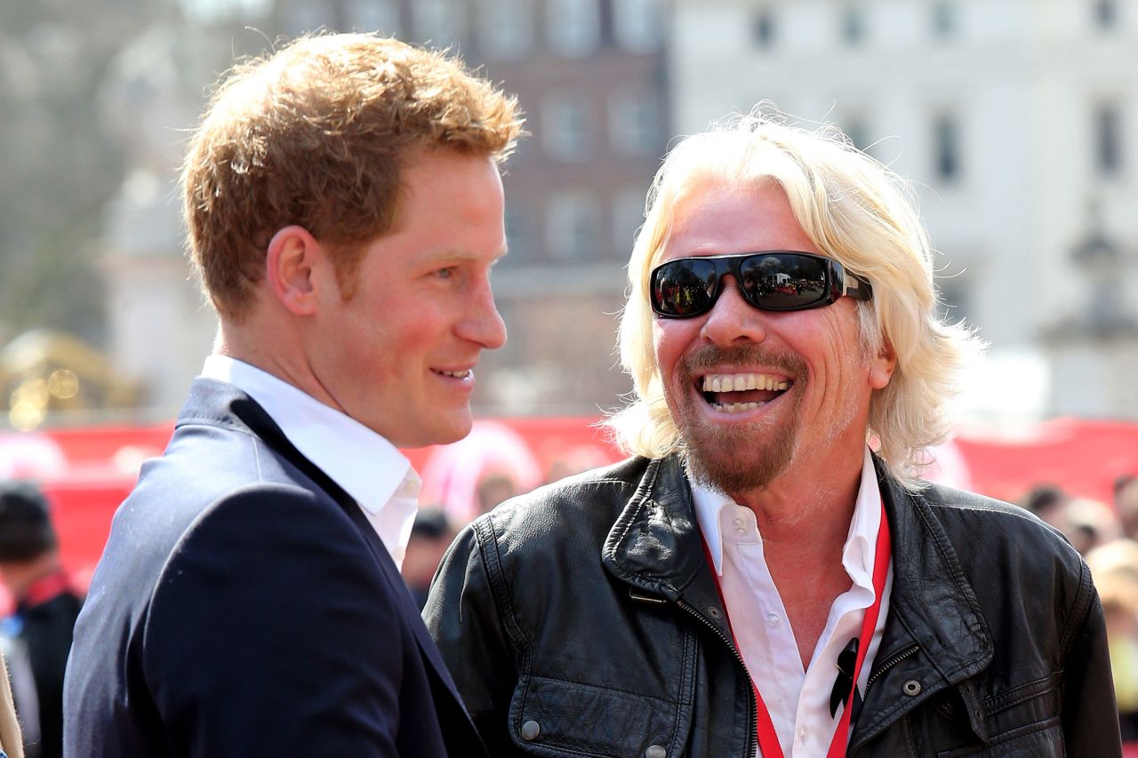 Branson chats with Britain's Prince Harry at the finish of the London Marathon in 2013. Virgin has been sponsoring the event for years.