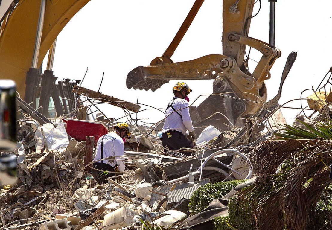 Rescue teams from Pennsylvania search the rubble of the Champlain Towers South on July 8.