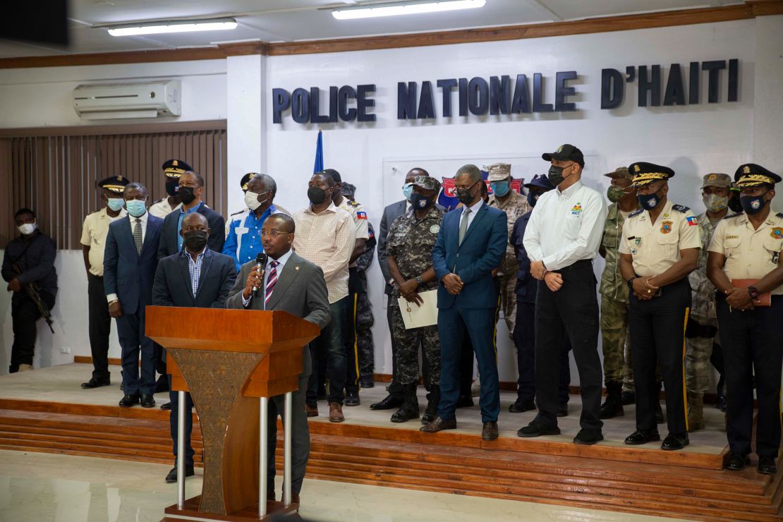 Interim President Claude Joseph, center, speaks to journalists during a press conference in Port-au-Prince, Haiti, on July 8.