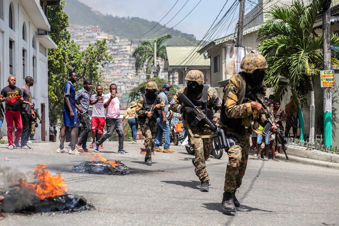 Citizens take part in a protest near the police station of Petion-Ville on July 8, 2021, following Moise's assassination.