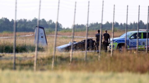 Police officers at the site of the crash on Thursday.