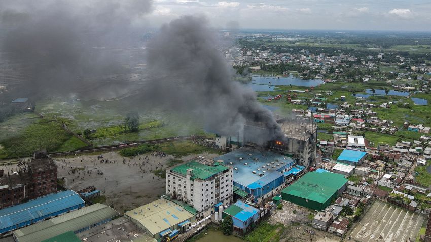 TOPSHOT - In this aerial photo taken on July 9, 2021 smoke bellows from a massive fire that broke out in a beverage and food factory in Rupganj in the district Narayanganj. (Photo by Munir Uz zaman / AFP) (Photo by MUNIR UZ ZAMAN/AFP via Getty Images)