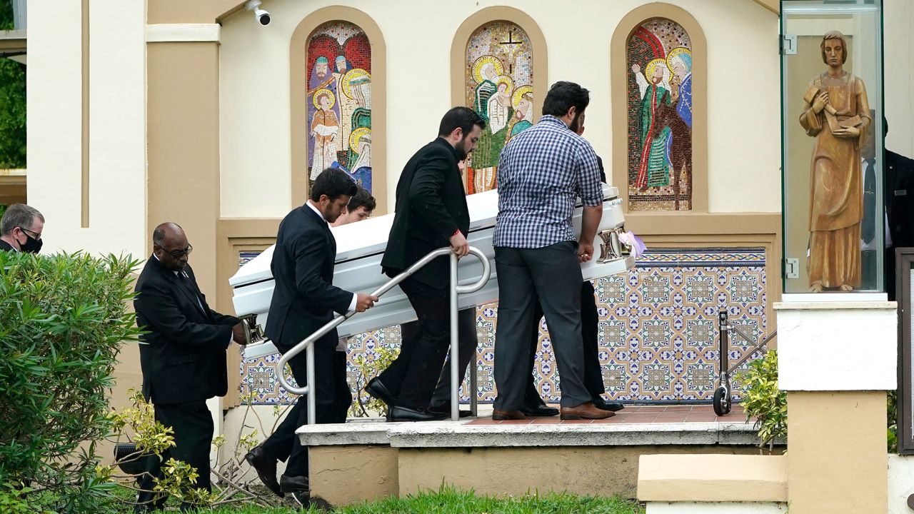 Pallbearers carry the shared casket of sisters Lucia and Emma Guara before their family's funeral service in Miami Beach on July 6.
