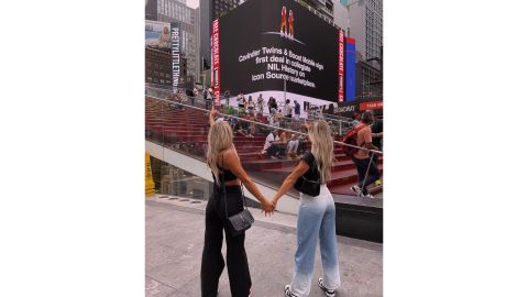 The Cavinder twins admiring their names on an electronic billboard in New York City.