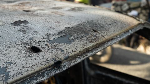 The charred shell of a car following the killing of Haiti's President. 