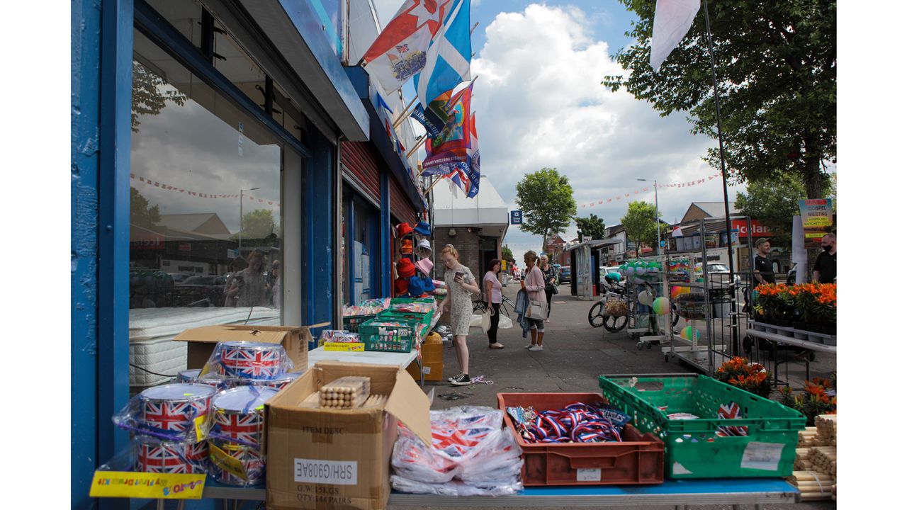 A girl peruses an array of marching season paraphernalia on the Shankill Road in west Belfast.