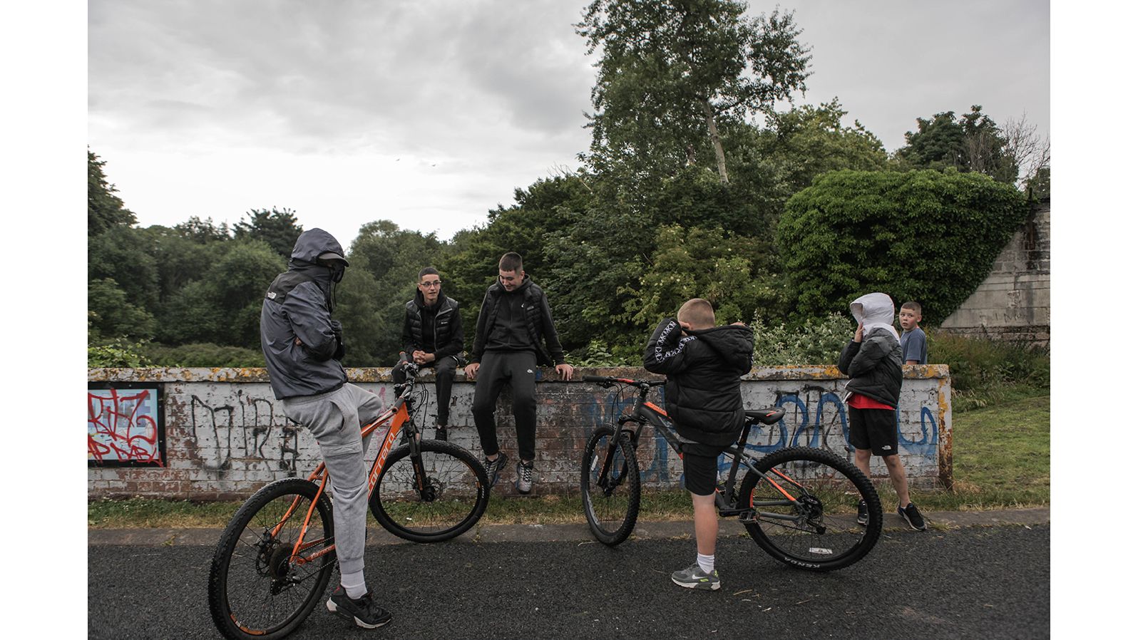 Youths gather near a "peace wall" in north Belfast's Alexandra Park. The peace wall, also referred to as a "separation barrier," is one of dozens of structures erected to separate predominantly republican and nationalist neighborhoods. 
