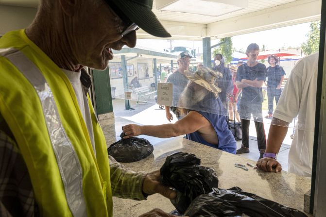 Volunteers hand out water and ice at a homeless-services facility in Sacramento, California, on July 8.