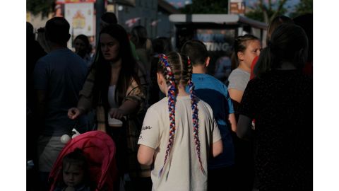 A young loyalist sporting red, white, and blue braids  -- the colors of the Union Flag -- attends a parade on the Shankill Road in west Belfast.  