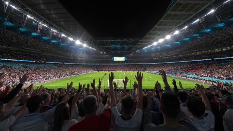 England fans cheer during the semifinal against Denmark at Wembley Stadium on July 7, 2021.