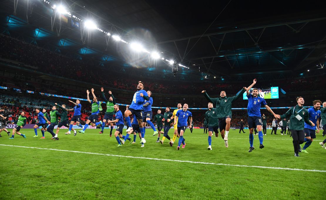 Players of Italy celebrate following their team's victory in the penalty shootout of the semi-final match against Spain.