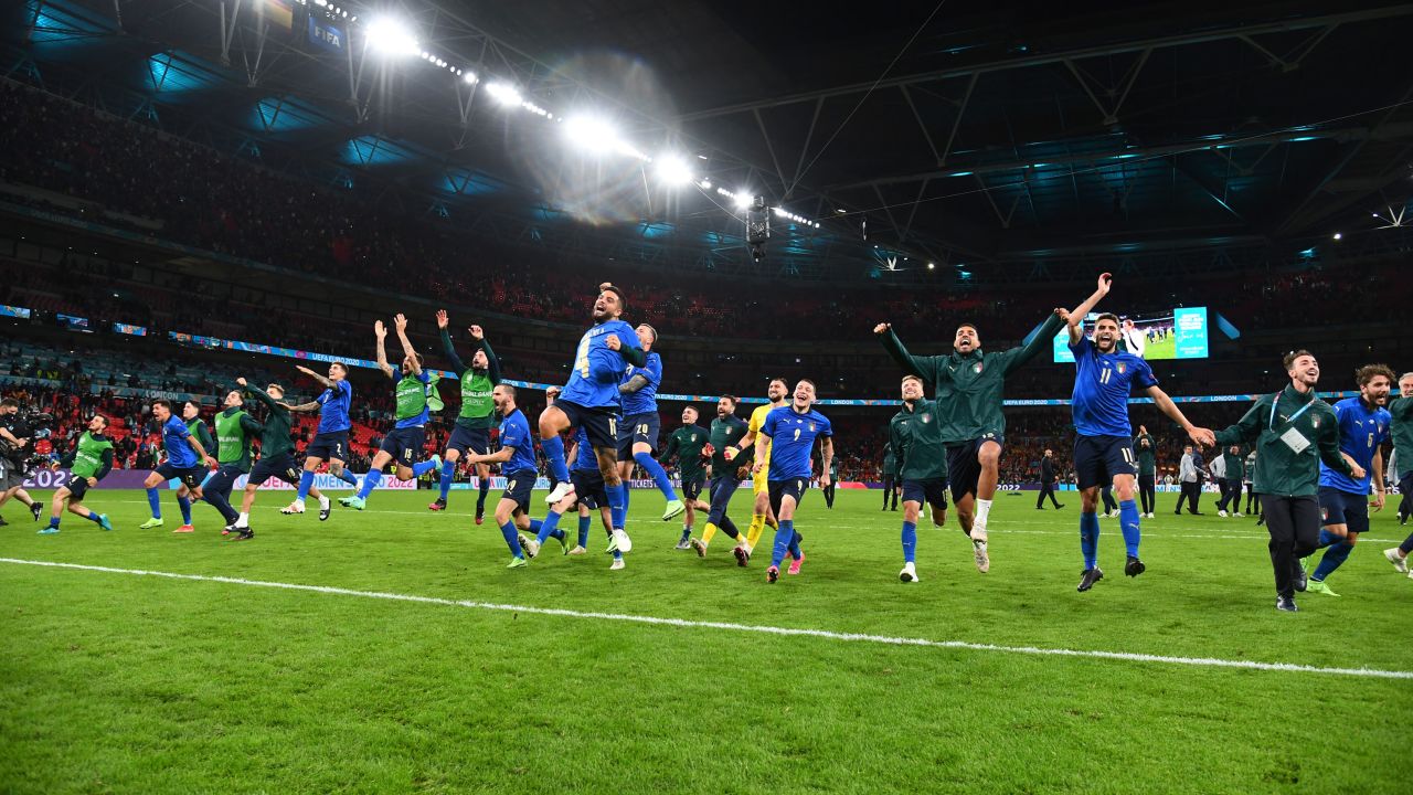 Players of Italy celebrate following their team's victory in the penalty shootout of the semi-final match against Spain.