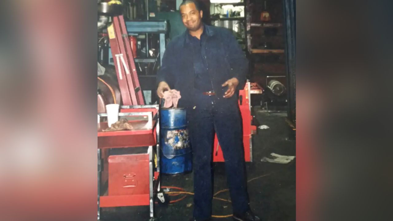 Middleton's father, Kevin Wayne Middleton Sr., works in his auto repair shop in the 1990s.