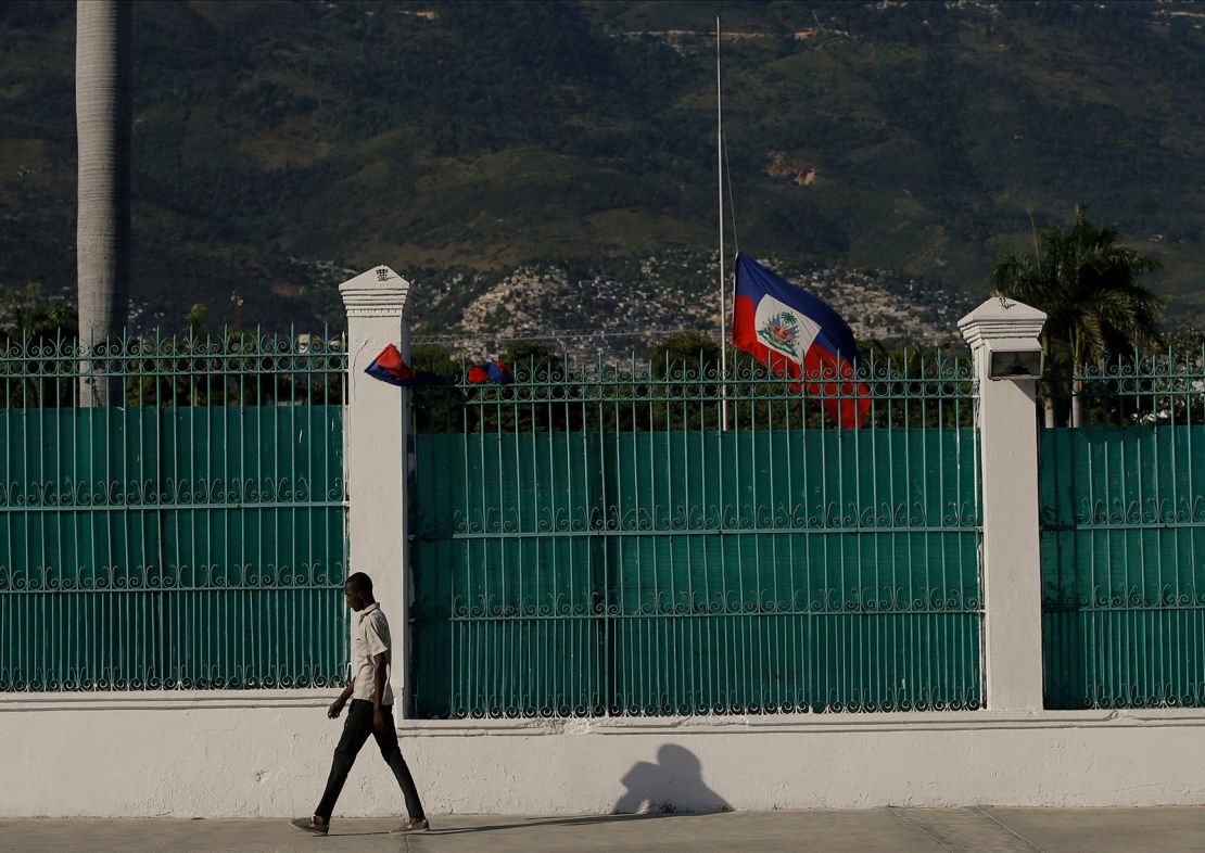 The Haitian flag flies at half-mast at the Presidential Palace in Port-au-Prince, Haiti, on July 10, three days after President Jovenel Moise was assassinated in his home. 