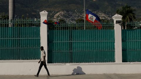 The Haitian flag flies at half-mast at the Presidential Palace in Port-au-Prince, Haiti, on July 10, three days after President Jovenel Moise was assassinated in his home. 
