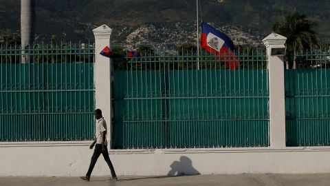The Haitian flag flies at half-mast at the Presidential Palace in Port-au-Prince, Haiti, on July 10, three days after President Jovenel Moise was assassinated in his home.