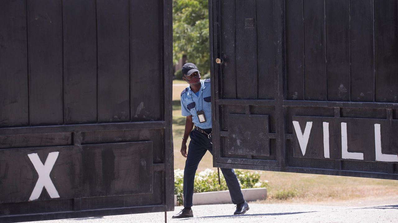 Guards watch the morgue where the body of President Jovenel Moise was being held on Saturday.