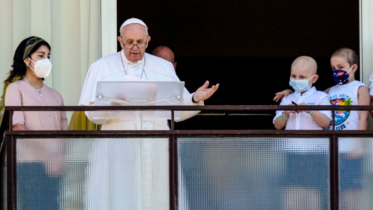 Pope Francis appears with young oncology patients on a balcony of the Agostino Gemelli Polyclinic in Rome, Sunday.