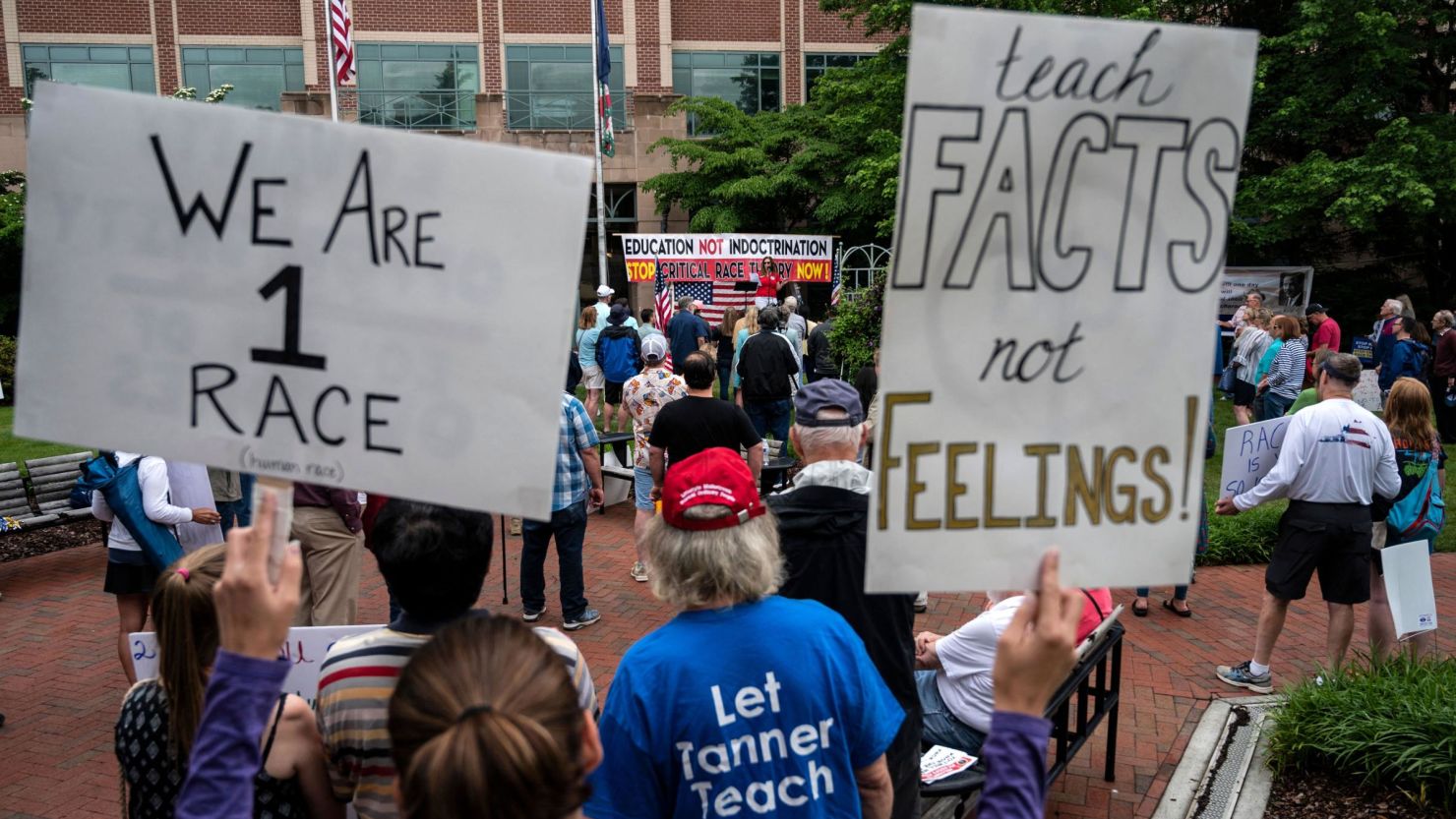 People attend a rally against critical race theory being taught in Loudoun County schools on June 12, 2021, in Leesburg, Virginia.