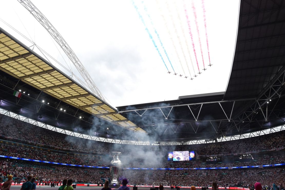 The Red Arrows fly overhead during the opening ceremony.