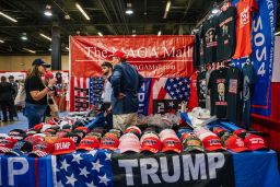 People view merchandise during the Conservative Political Action Conference held on July 10, 2021, in Dallas. 