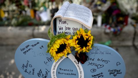 Notes are written on a makeshift headstone for Francis Fernandez, a victim in the collapse.