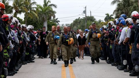 Members of Israel's National Rescue Unit are given a send-off by search and rescue personnel on July 10 in Surfside, Florida.