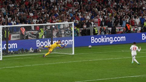 Italy's goalkeeper Gianluigi Donnarumma saves Sancho's penalty during the penalty shoot out during the Euro 2020 final.
