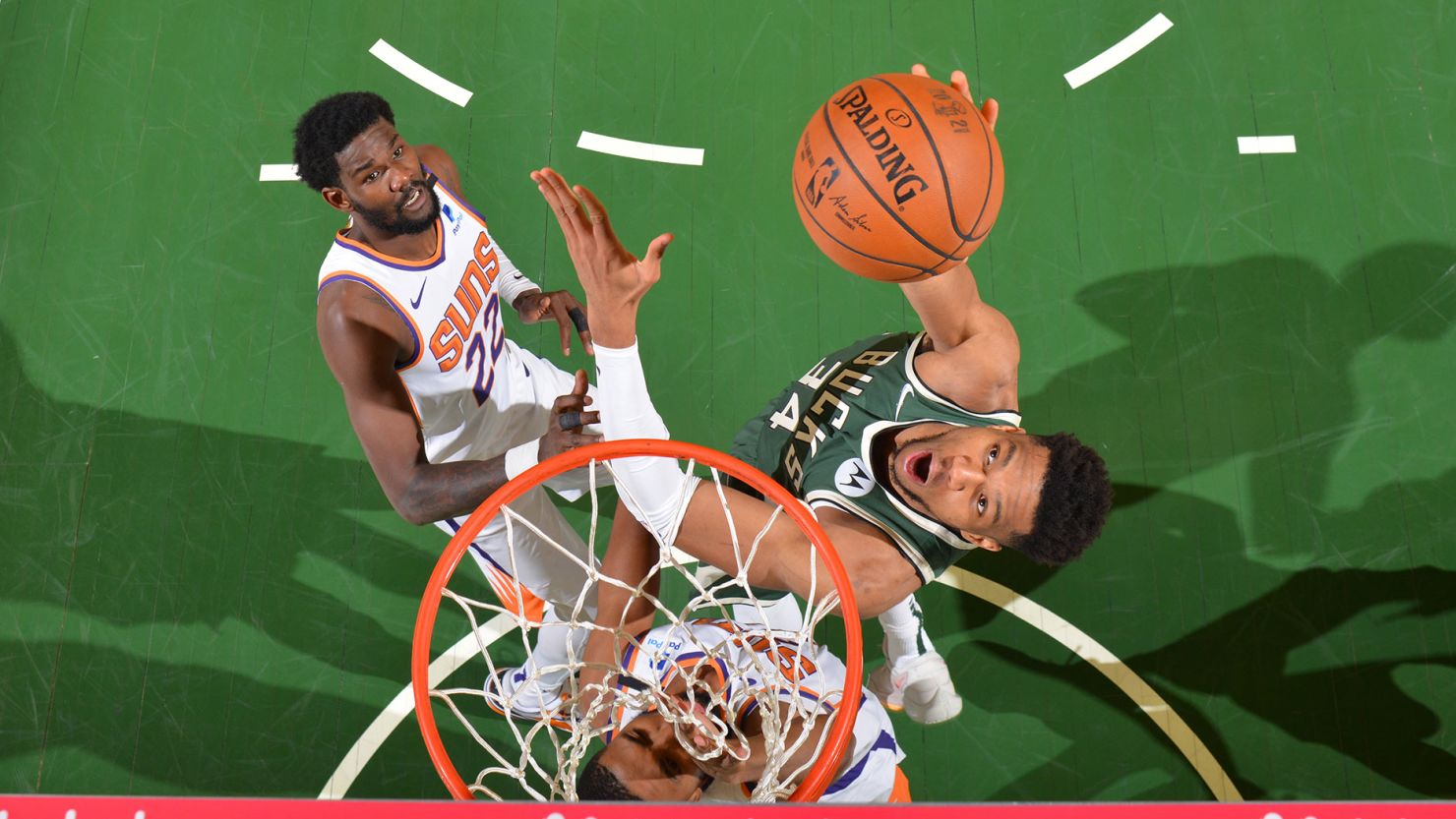 Giannis Antetokounmpo dunks the ball against the Phoenix Suns during Game 3 of the NBA Finals.