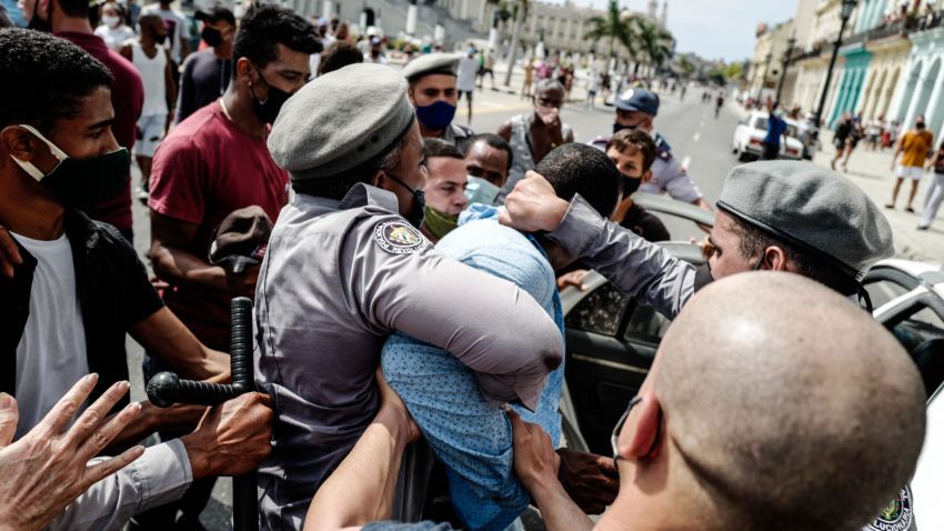 A man is arrested during a demonstration against the government of Cuban President Miguel Diaz-Canel in Havana, on July 11, 2021. - Thousands of Cubans took part in rare protests Sunday against the communist government, marching through a town chanting "Down with the dictatorship" and "We want liberty." (Photo by ADALBERTO ROQUE / AFP) (Photo by ADALBERTO ROQUE/AFP via Getty Images)
