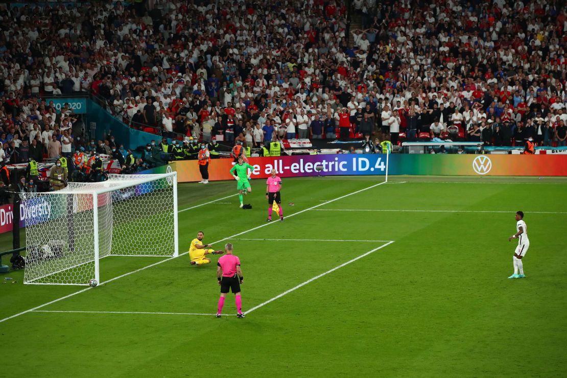 Marcus Rashford misses England's third penalty in the shootout.