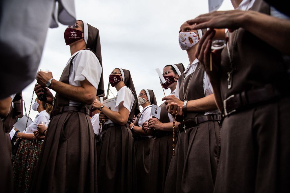 Nuns from the St. Joseph's Catholic Church pray at the memorial site on July 7.