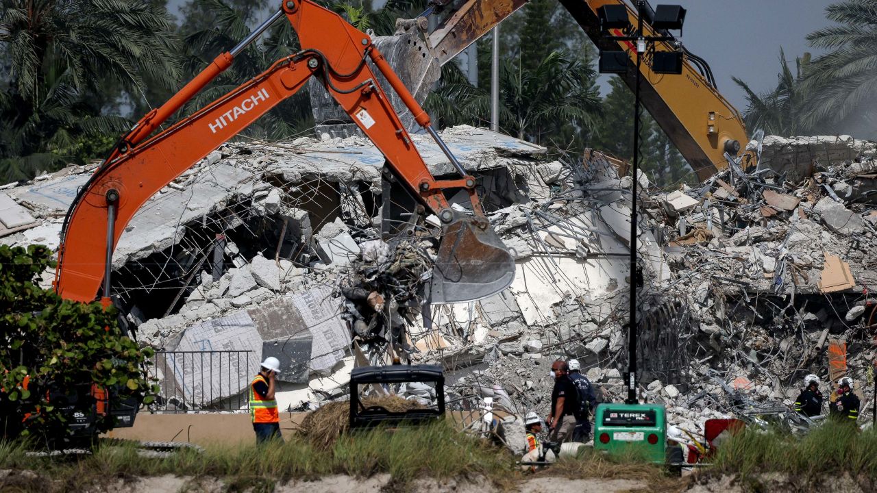 Excavators dig through the remains from the collapsed 12-story Champlain Towers South condo building on July 9, 2021 in Surfside, Florida. 