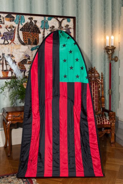 A tent outfit featuring artist David Hammons' African-American flag design.