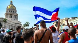 TOPSHOT - Cubans are seen outside Havana's Capitol during a demonstration against the government of Cuban President Miguel Diaz-Canel in Havana, on July 11, 2021. - Thousands of Cubans took part in rare protests Sunday against the communist government, marching through a town chanting "Down with the dictatorship" and "We want liberty." (Photo by YAMIL LAGE / AFP) (Photo by YAMIL LAGE/AFP via Getty Images)