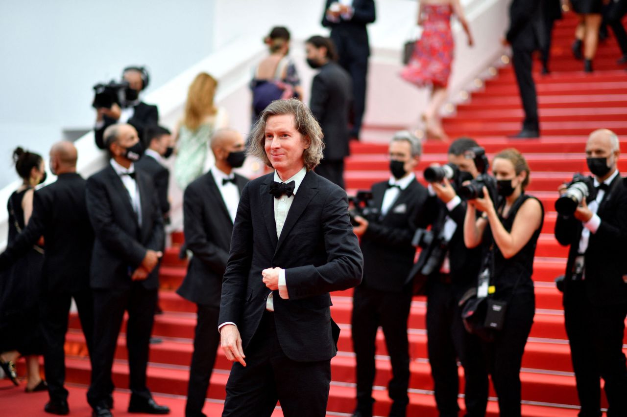 Director Wes Anderson wore a black tux and pastel green shirt.
