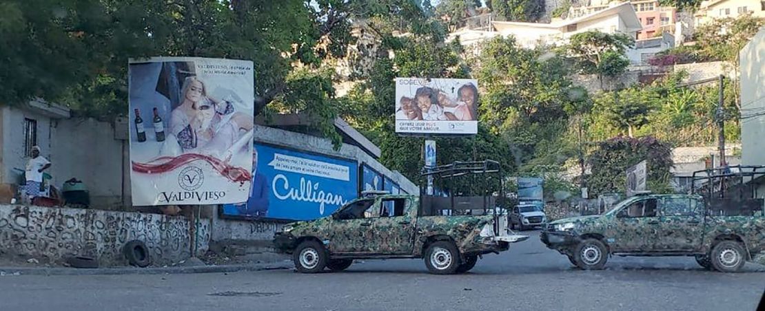 Haitian security forces' vehicles blocking the road.