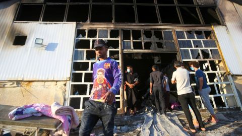People inspect the hospital after the fire.