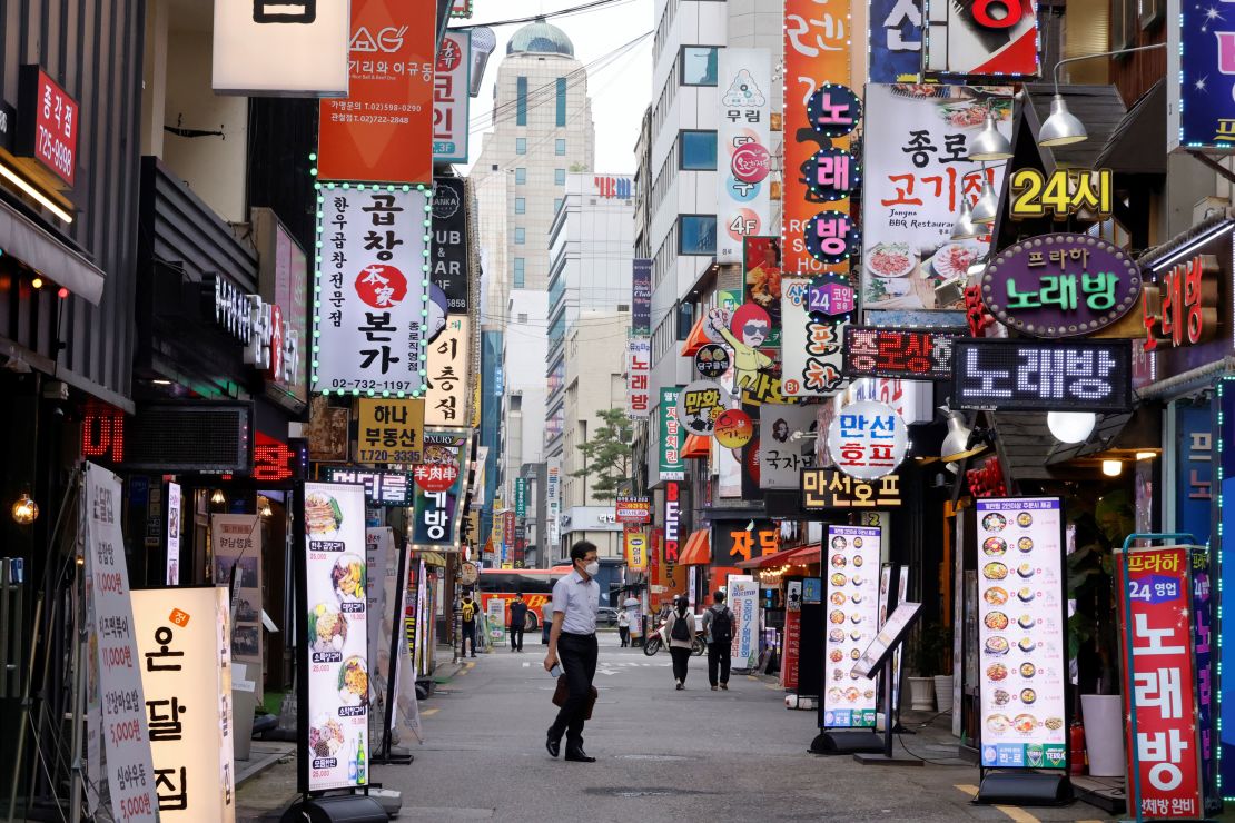 A man walks on a nearly empty street amid tightened social distancing rules in Seoul, South Korea, on July 12.