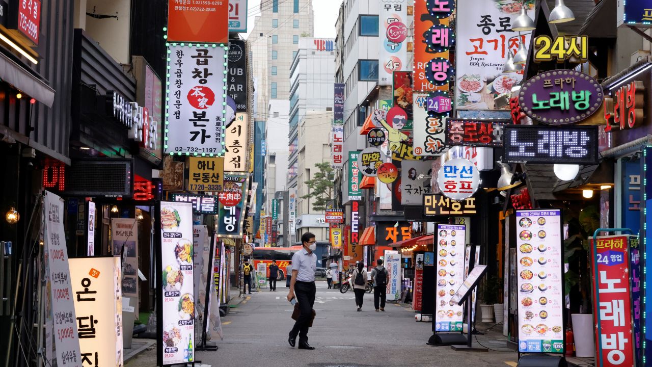 A man walks on a nearly empty street amid tightened social distancing rules in Seoul, South Korea, on July 12.