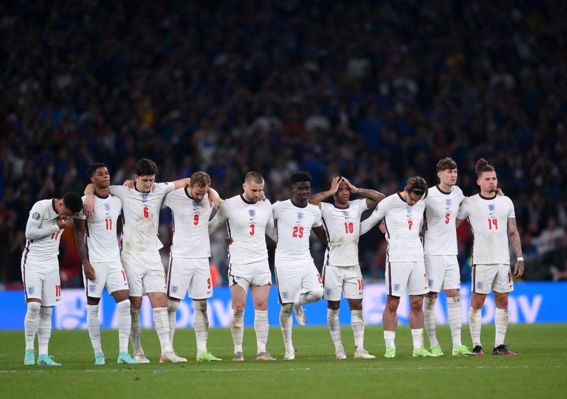 England players, including Rashford, look on during the penalty shoot out against Italy.