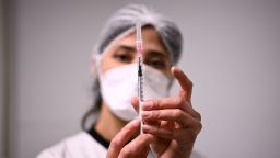 A health worker prepares a syringe with the Pfizer/BioNTech Covid-19 vaccine on January 6, 2021, in Aulnay-sous-Bois.