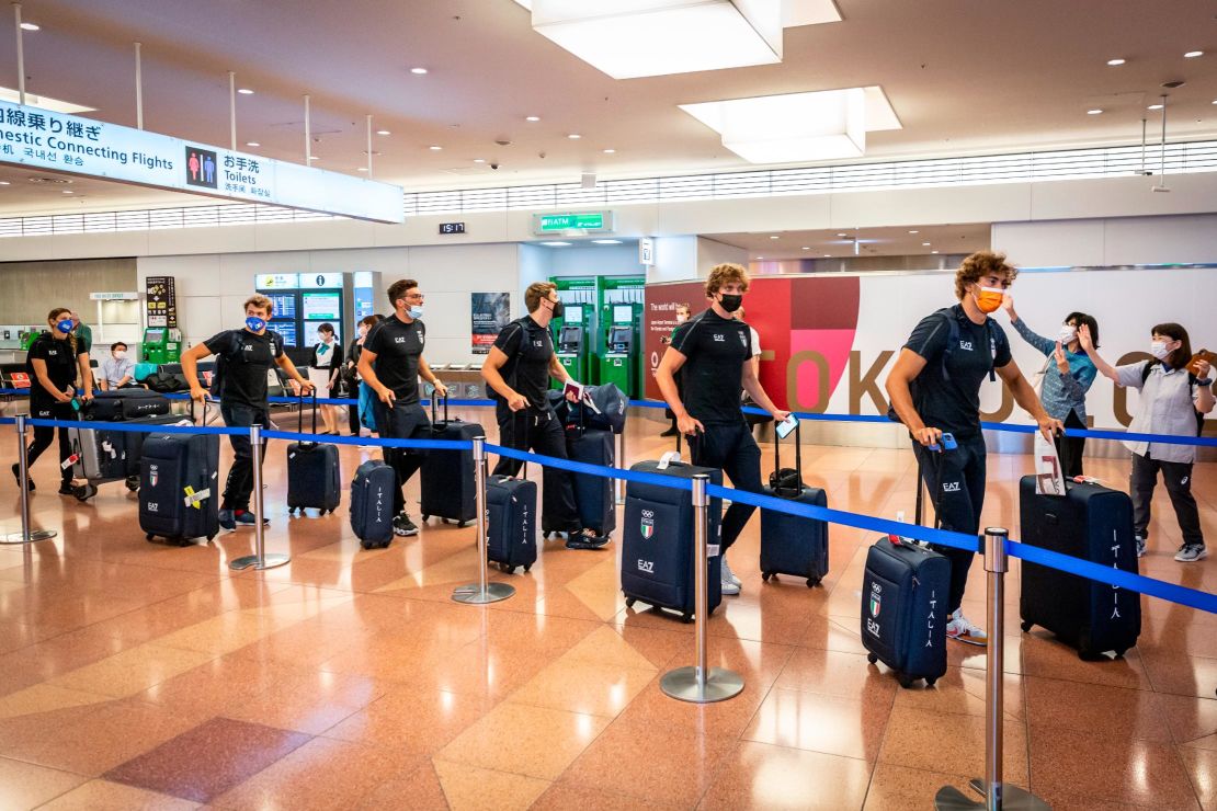 Members of Italy's Olympic delegation arrive in Tokyo. 