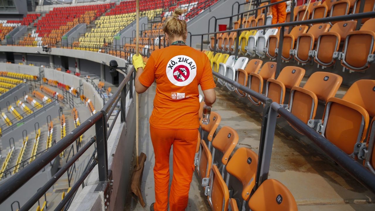 A cleaner at Rio's Olympic Tennis Center wears a shirt with an anti-Zika slogan, August 2016.