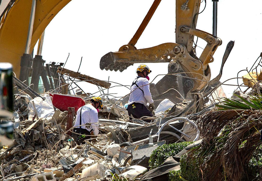 Rescue teams from Pennsylvania search the rubble of the Champlain Towers South on July 8, 2021.