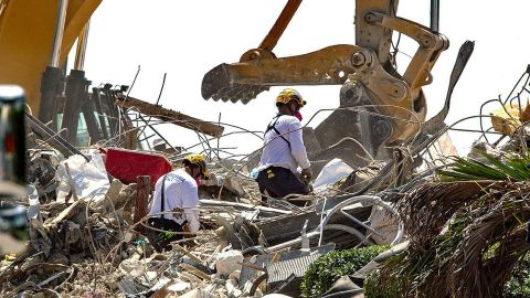 Rescue teams from Pennsylvania search the rubble of the Champlain Towers South on July 8, 2021.