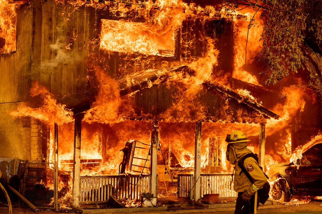 Fire consumes a home as the Sugar Fire, part of the Beckwourth Complex Fire, tears through Doyle, California, on Saturday, July 10, 2021.
