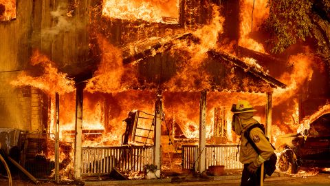 Fire consumes a home as the Sugar Fire, part of the Beckwourth Complex Fire, tears through Doyle, California, on Saturday, July 10, 2021. 