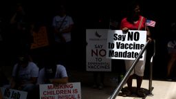 Anti-vaccine rally protesters hold signs outside of Houston Methodist Hospital in Houston, Texas, on June 26, 2021. - A spokesperson for Houston Methodist Hospital said on June 23, 153 employees either resign or were fired for refusing to be vaccinated. (Photo by Mark Felix / AFP) (Photo by MARK FELIX/AFP /AFP via Getty Images)